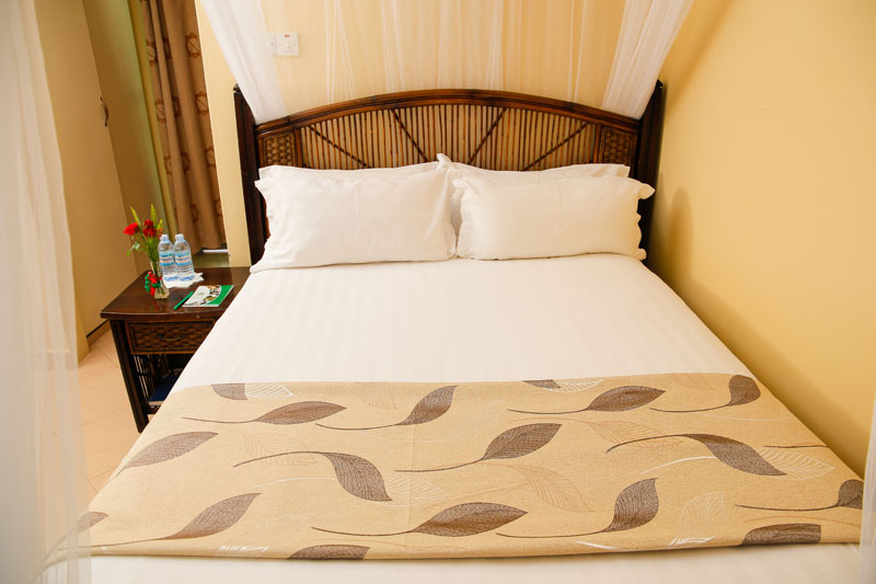 Restful double bed at Maya Nature Resort.
